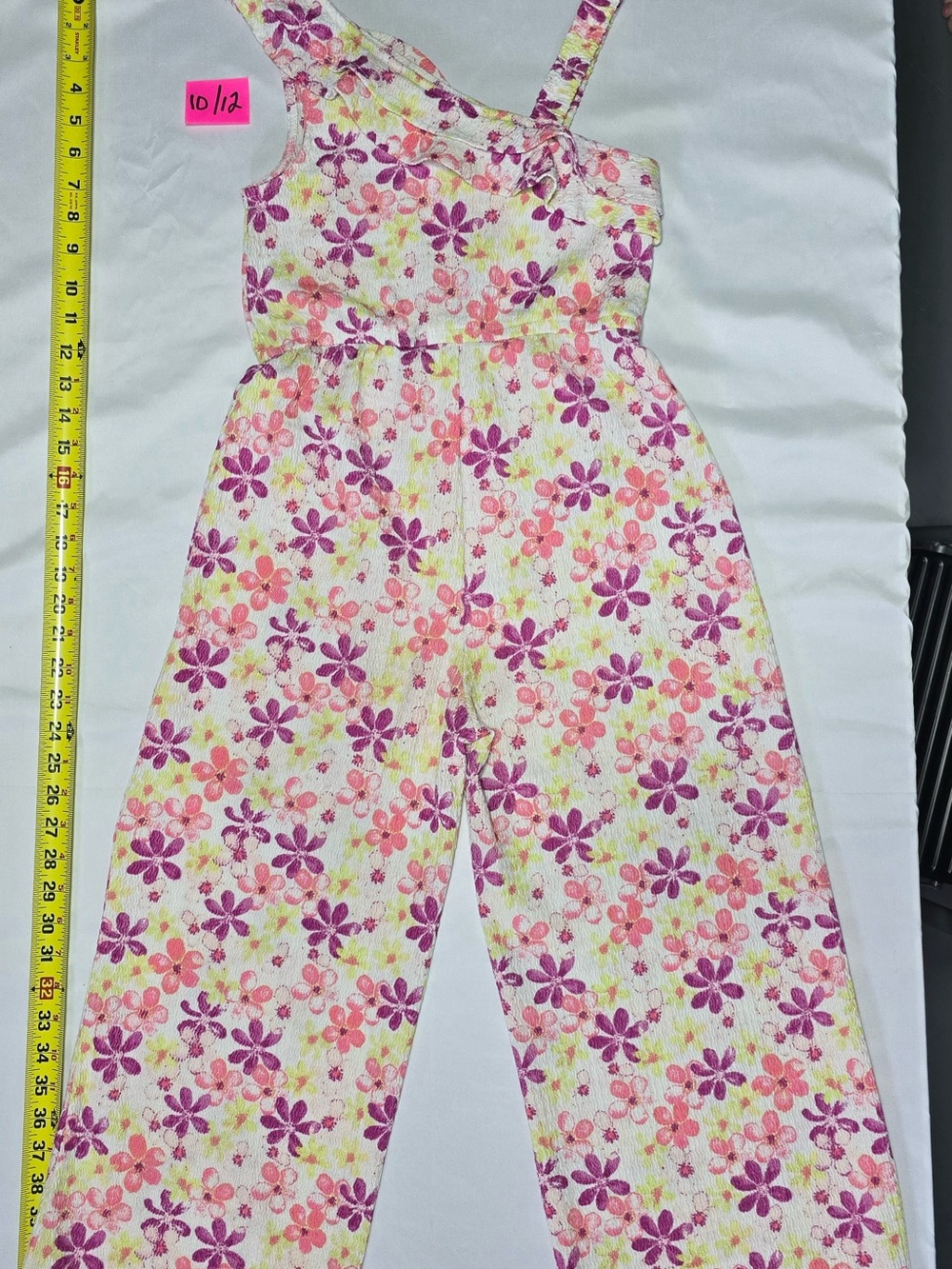 Multicolored floral-print sleeveless jumpsuit with an asymmetrical strap design